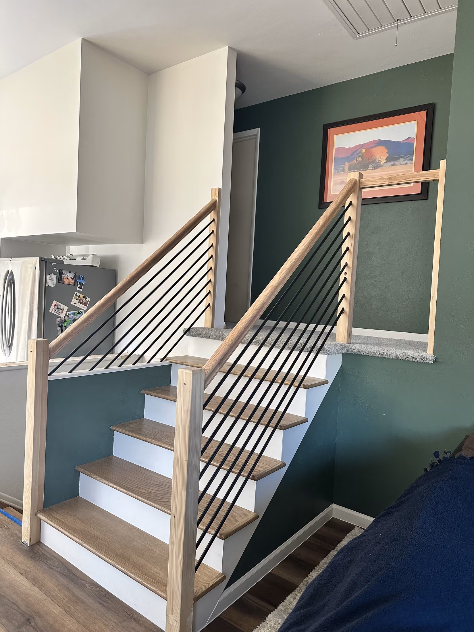 Custom stair treads and railing connection detail