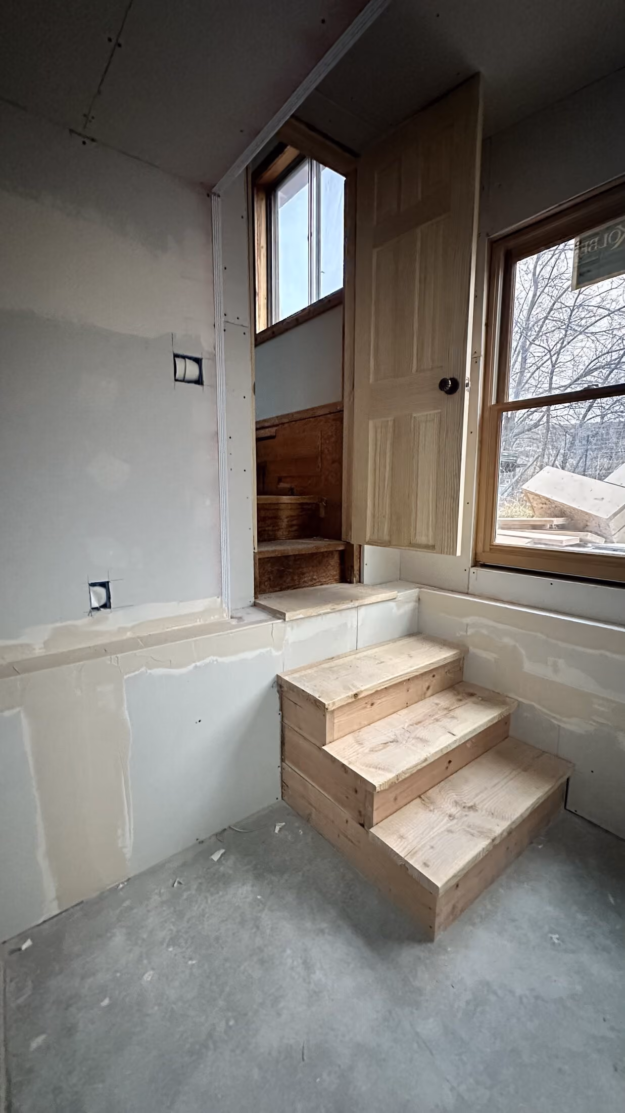 New window opening and interior step detail inside the addition