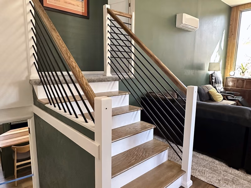 Finished custom stair and railing in the Pleasant Valley whole-home renovation