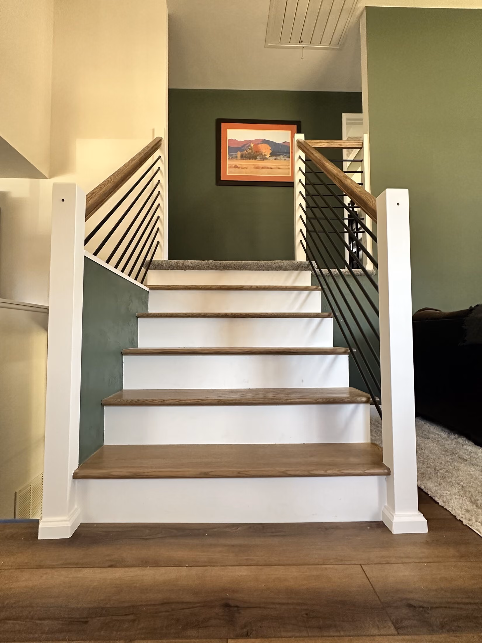 Front view of the rebuilt stair with custom railing