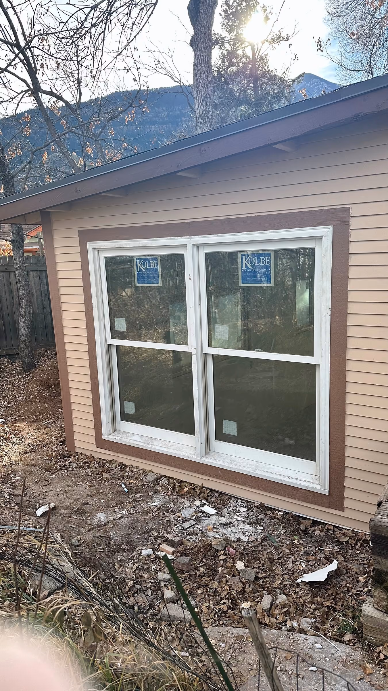Completed Manitou Springs addition with paired windows, siding, and contrasting trim
