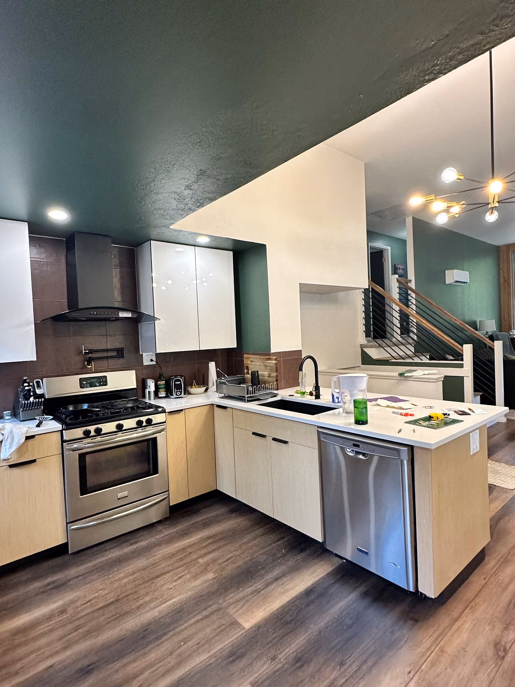 Pleasant Valley kitchen renovation with the custom stair and railing visible beyond the island