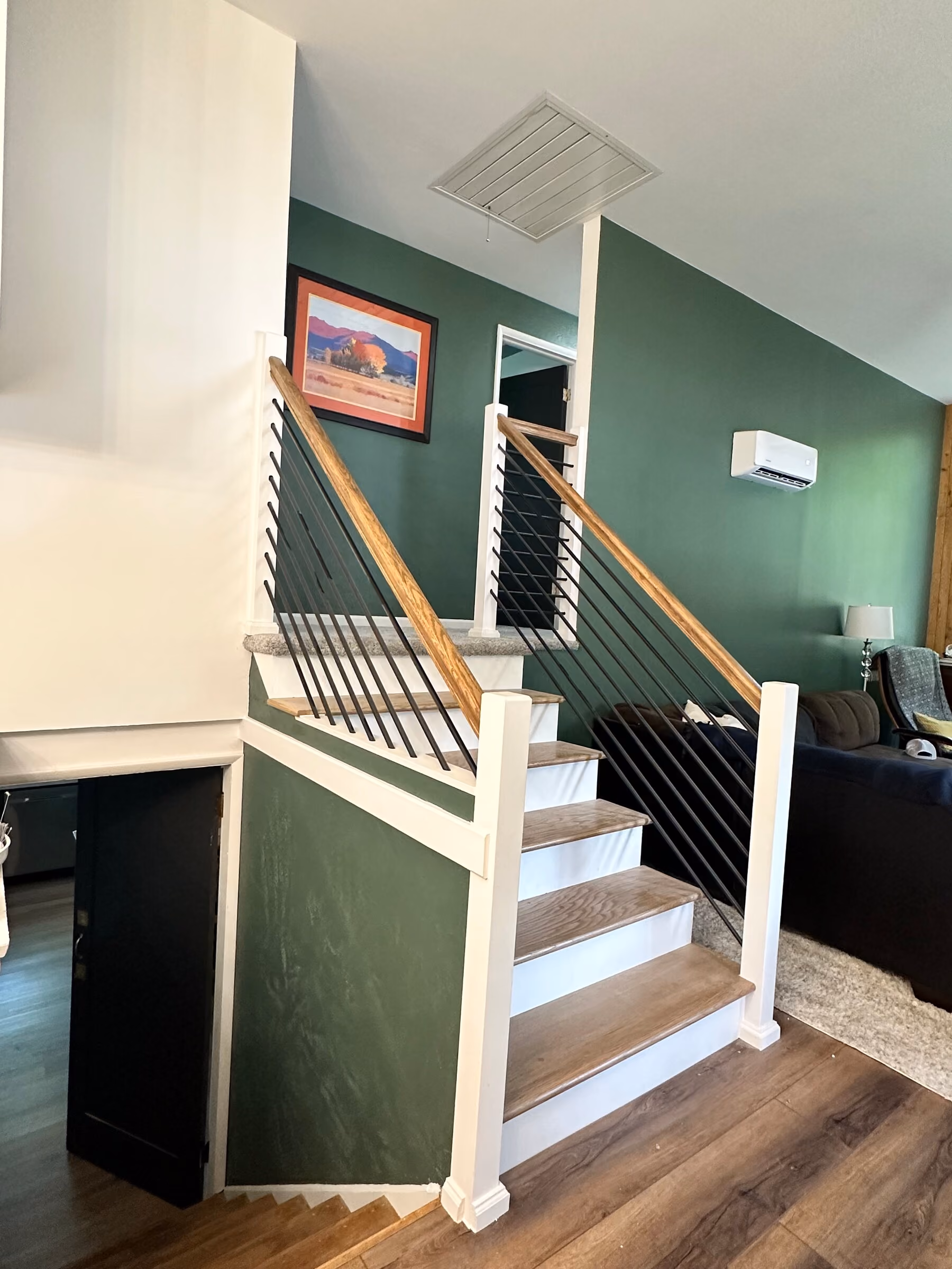 Custom stair and railing shown in the context of the Pleasant Valley living space